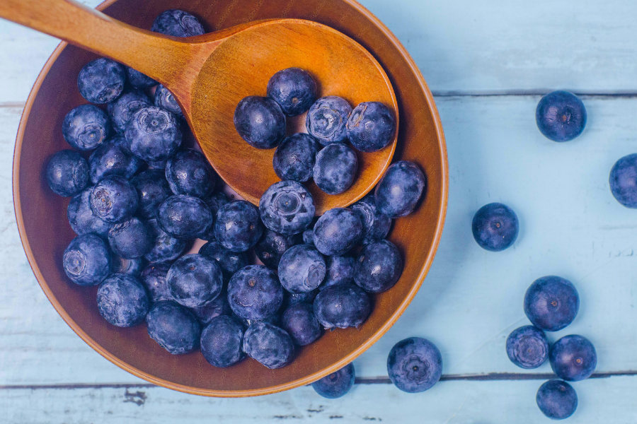blueberries on a blue table