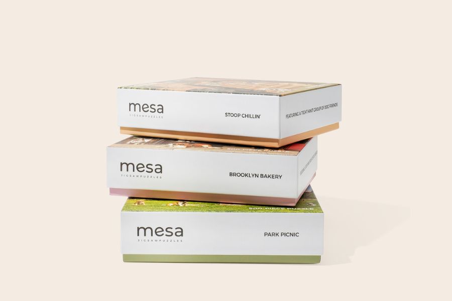 three puzzle boxes stacked