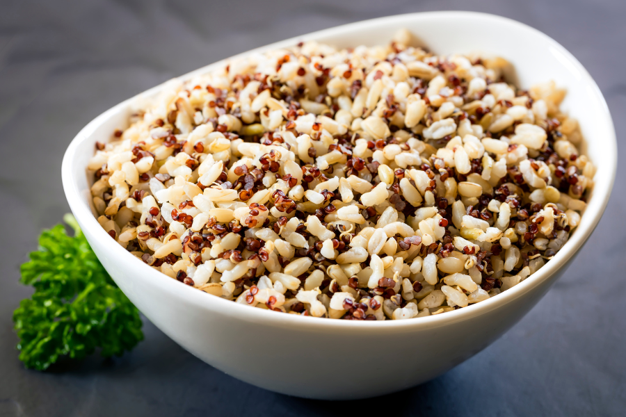 a bowl full of multi color quinoa