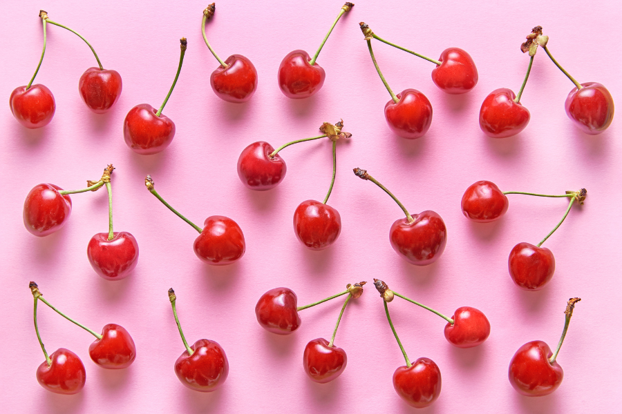 cherries on a pink background