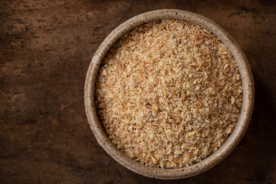 a bowl of ground flaxseeds