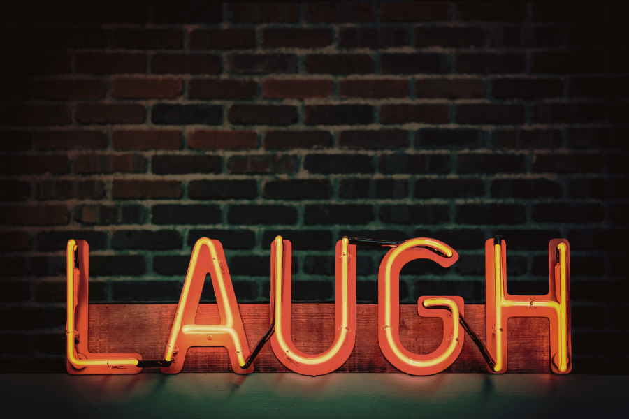a sign that says the word laugh