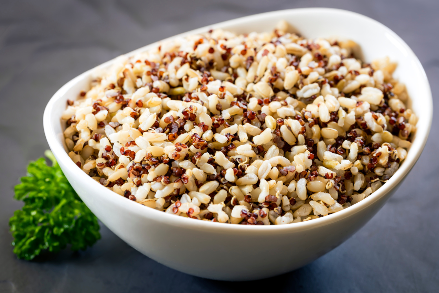 a bowl full of multi color quinoa 