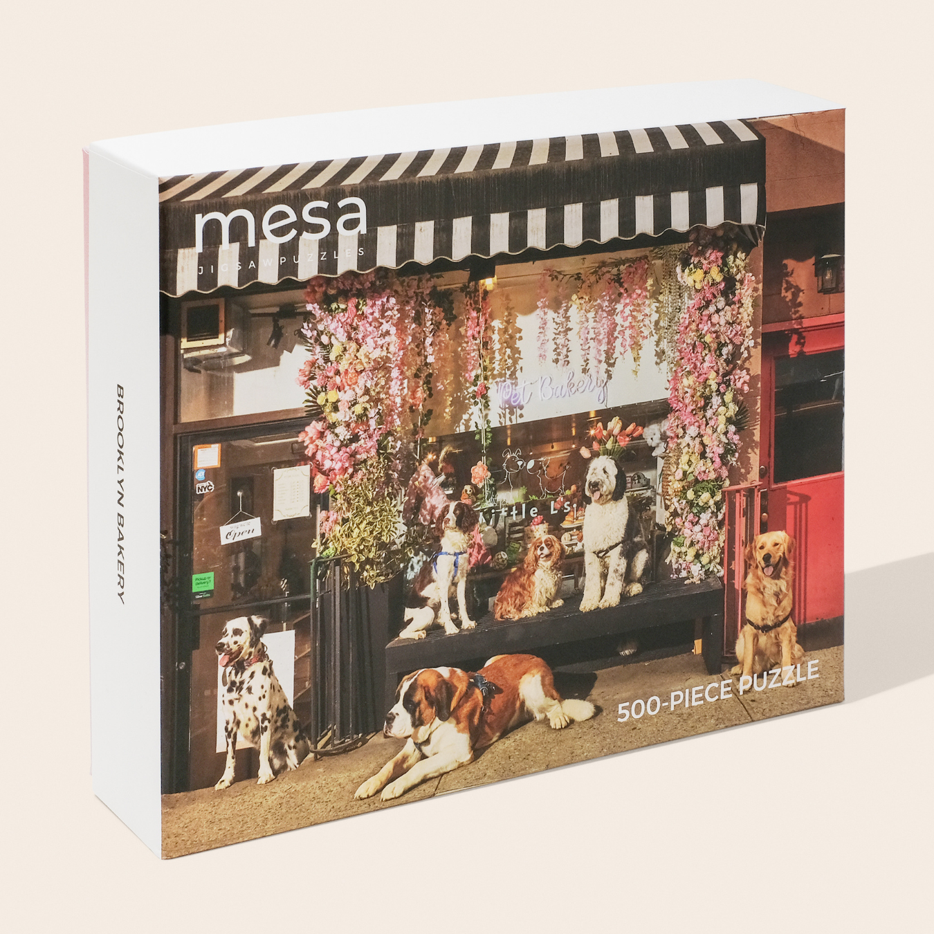 a dog bakery with dogs in front of it